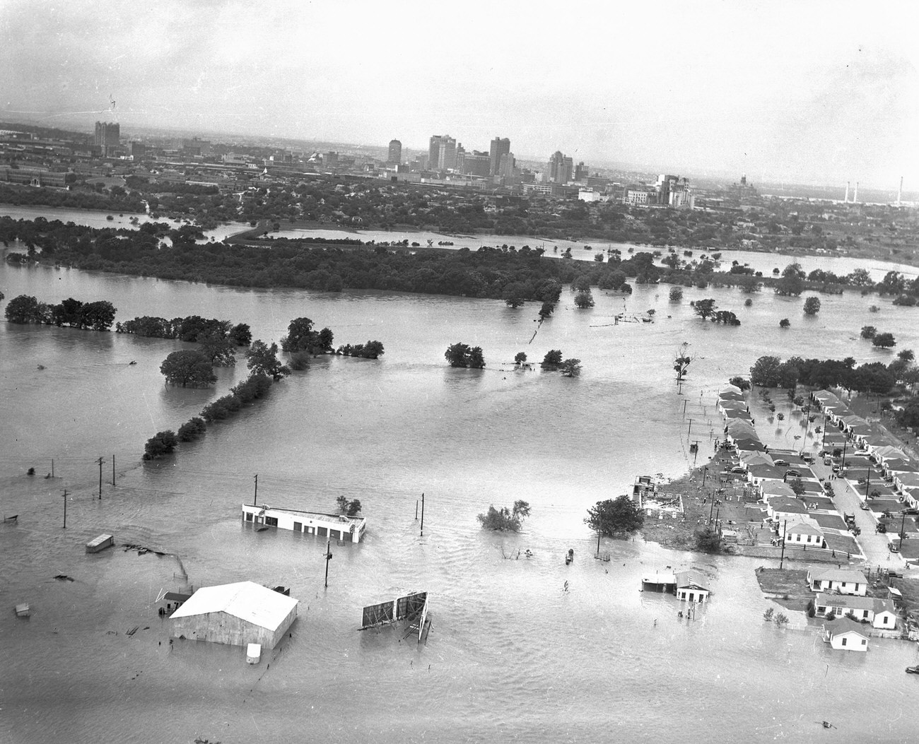 Fort Worth, Texas, flood of 1949, showing submerged homes. Downtown Fort Worth is visible in the distance.