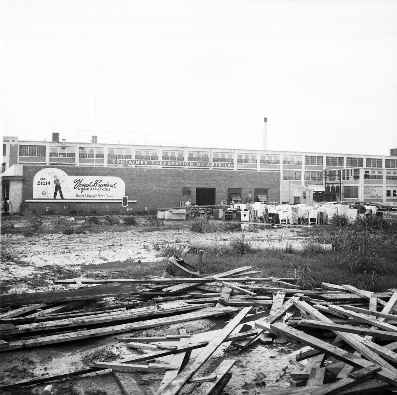 This photograph shows the Container Corporation of America building exterior after the 1949 Fort Worth flood.
