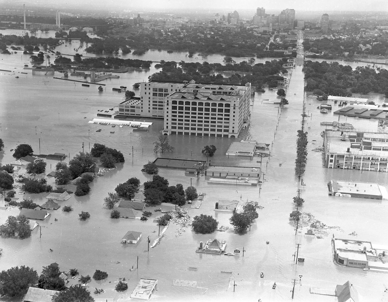 Fort Worth, Texas, flood of 1949, showing 7th Street under water. The large Montgomery Ward building in the upper center received extensive damage.