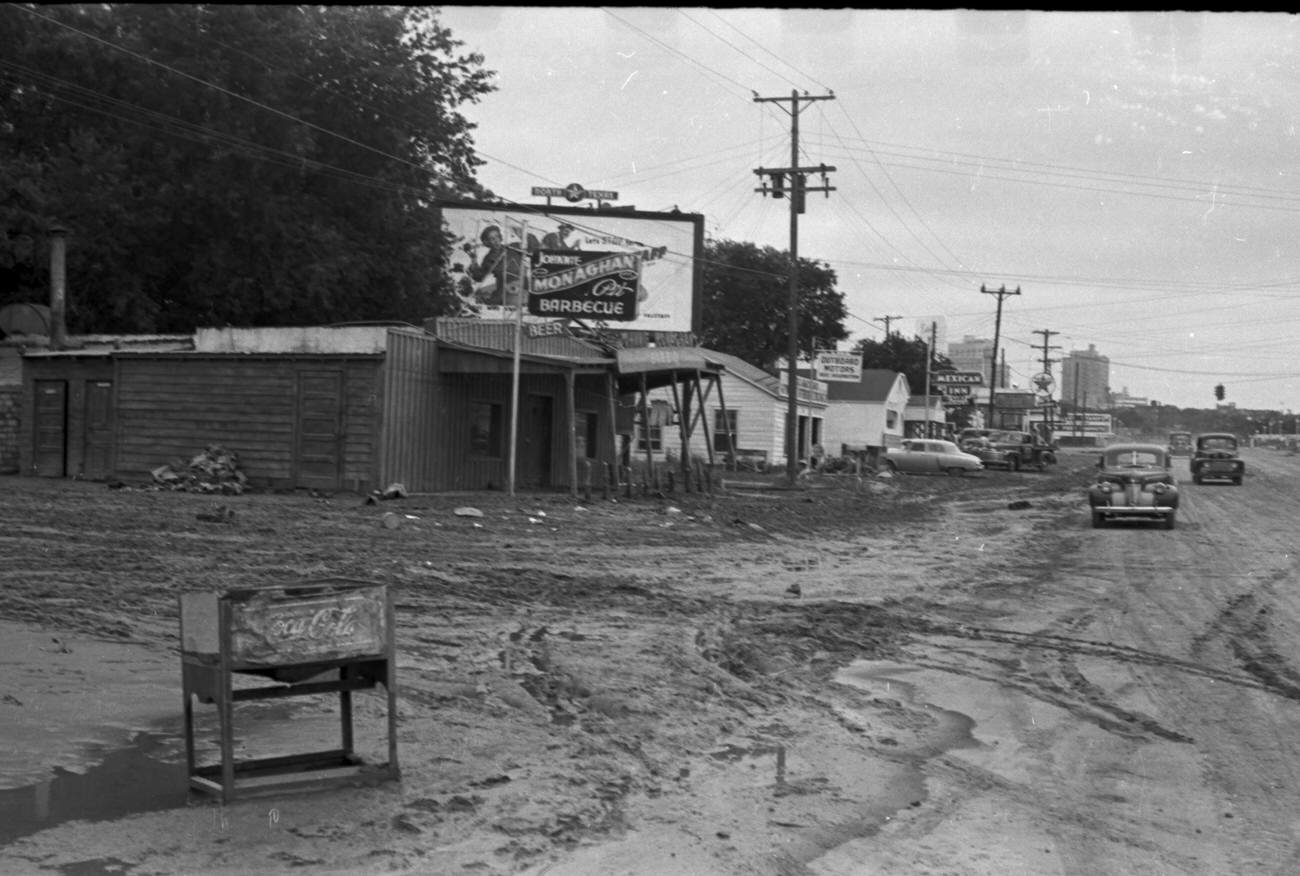 Flood scenes of commercial and residential buildings, 1949