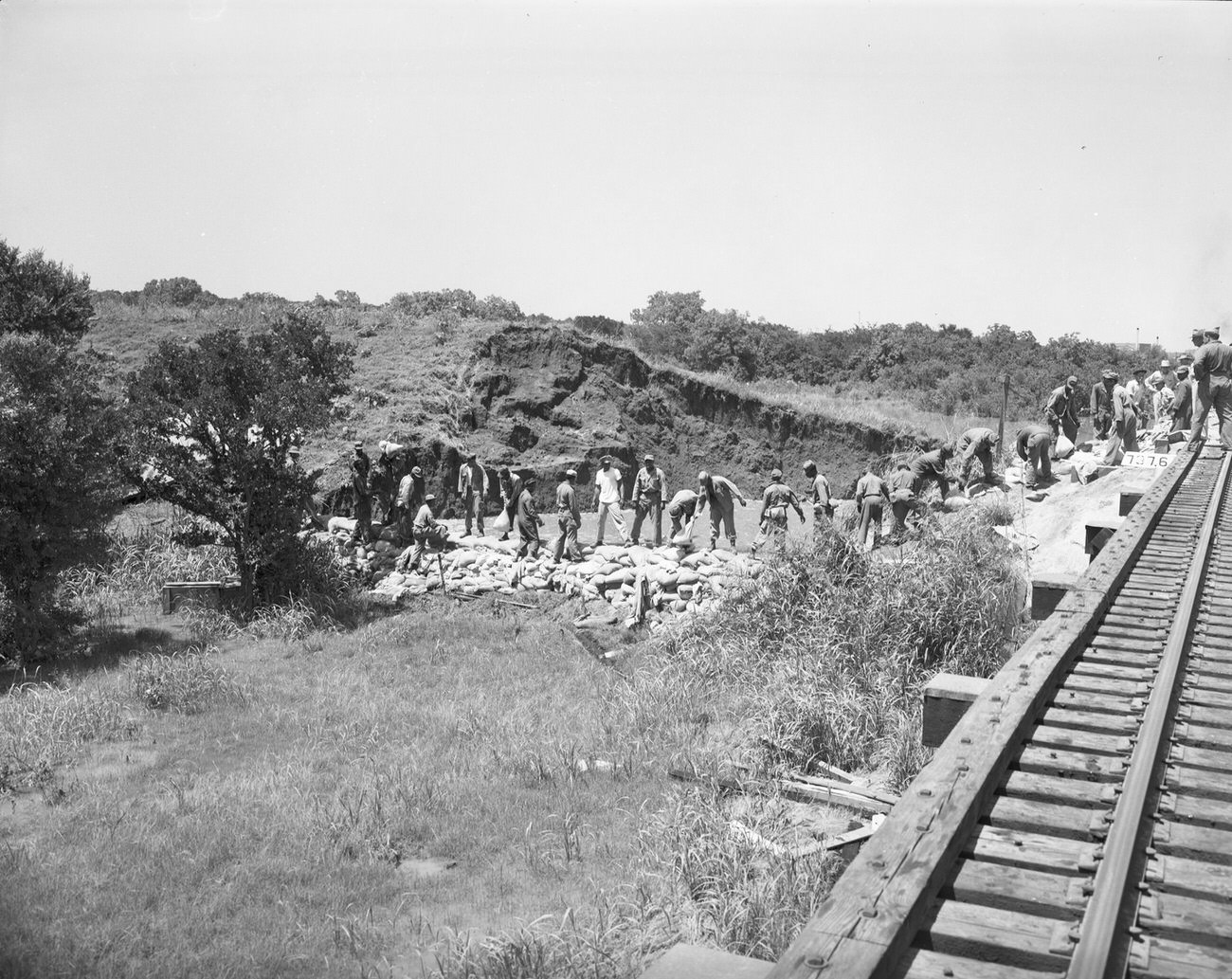 Flood damage from the north railroad track off the levee off of Henderson Street, 1949