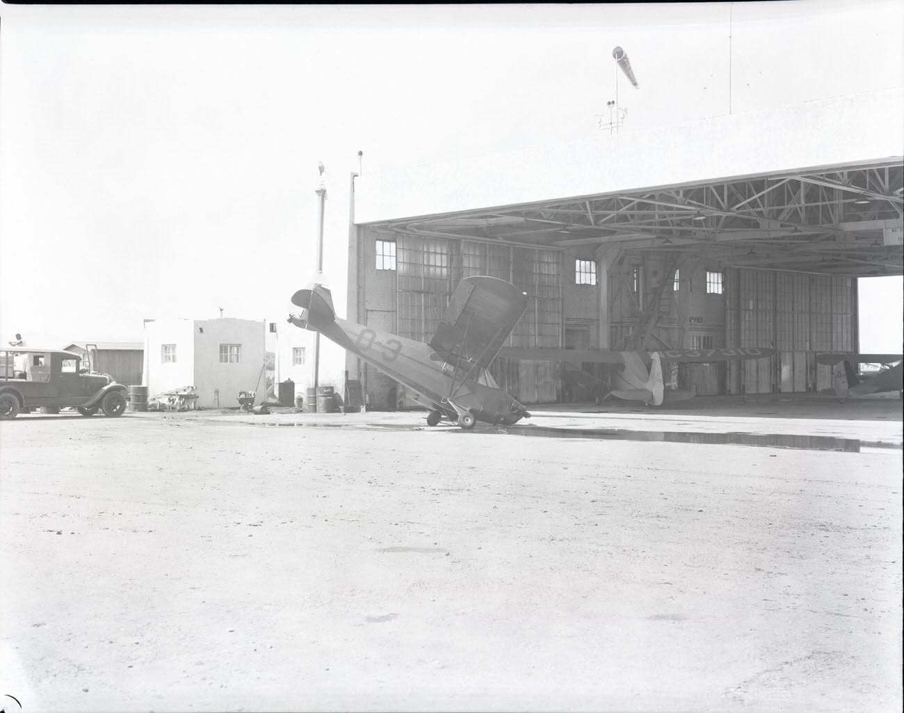 Damaged Airplane in Front of Hangar at Sky Harbor Airport, 1942
