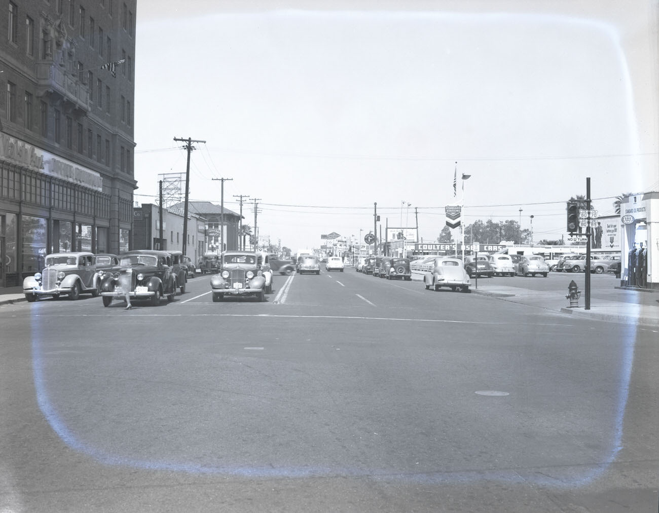 Intersection of W. Van Buren St. and Central Avenue, 1942. Office Equipment, Coulter's Used Cars (312 N. Central) and Western Auto Supply (247 N. 1st Ave) are visible