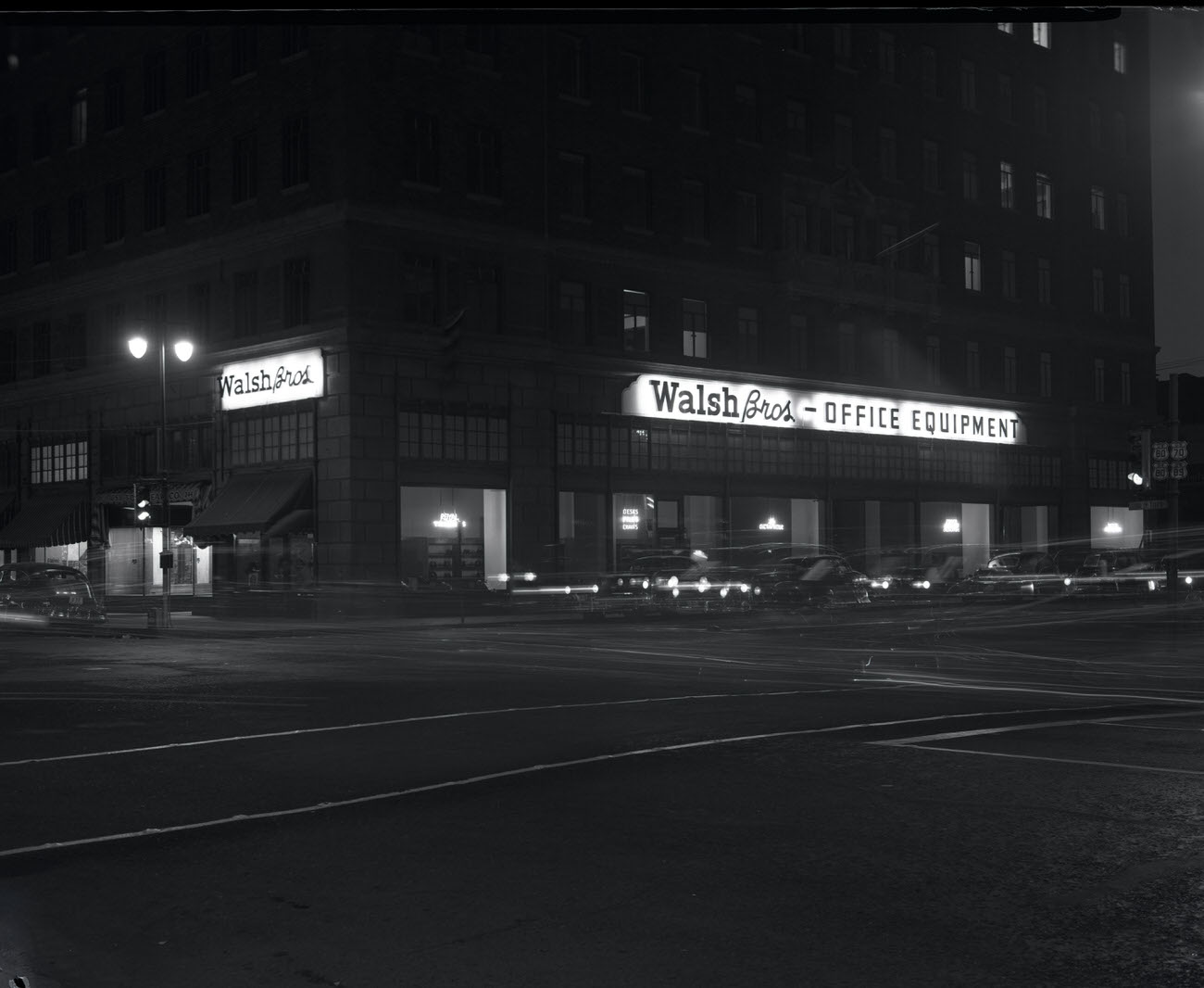 Walsh Bros. Office Equipment Sign at Night, 1942