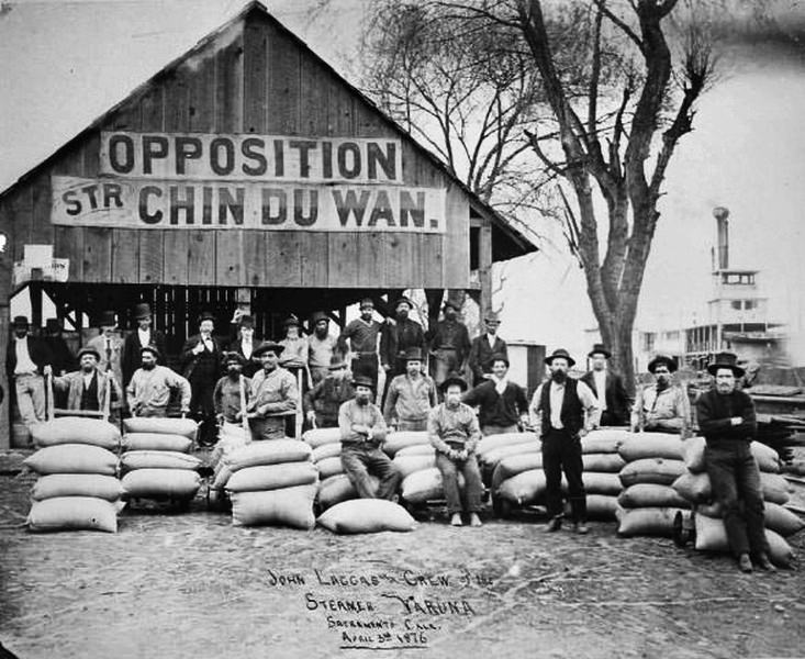 Hauling columns from Central Pacific Railroad wharf to Capitol building, on J Street between 3rd and 4th Streets, Sacramento. May 25, 1871.