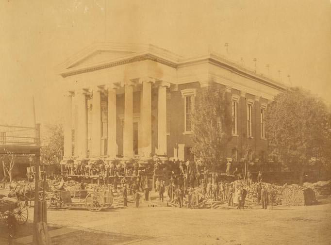 View of the raising of the Sacramento County Courthouse on the northwest corner of 7th & I Streets, 1870