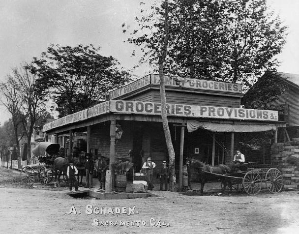 Exterior view of the A(rend) Schaden Family Grocery at the southeast corner of 2nd and M Streets in Sacramento, 1878