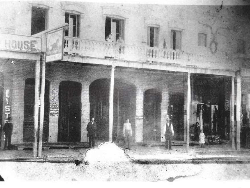 An interior view of what appears to be an unidentified fraternal or lodge meeting room in an unidentified location, 1870s