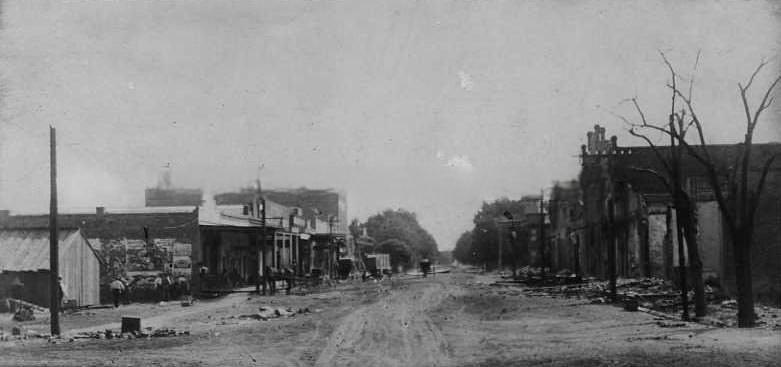 View of the original Central Pacific Railroad Hospital with horse and carriage in circular drive, 1875