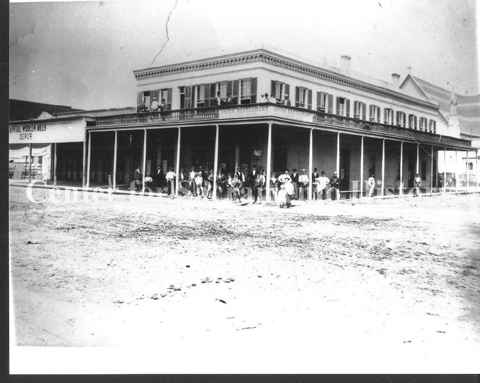 View of the California State Capitol building from 2 blocks away and looking southeast, 1870