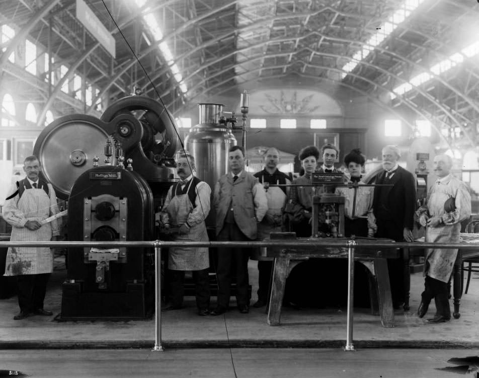 Government workers stand by exhibits in the United States Government building at the Louisiana Purchase Exposition, 1904
