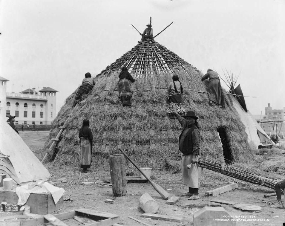 Wichita Indian women build a grass lodge in the Native American section of the Anthropology exhibits at the Louisiana Purchase Exposition, the 1904 St. Louis World's Fair.