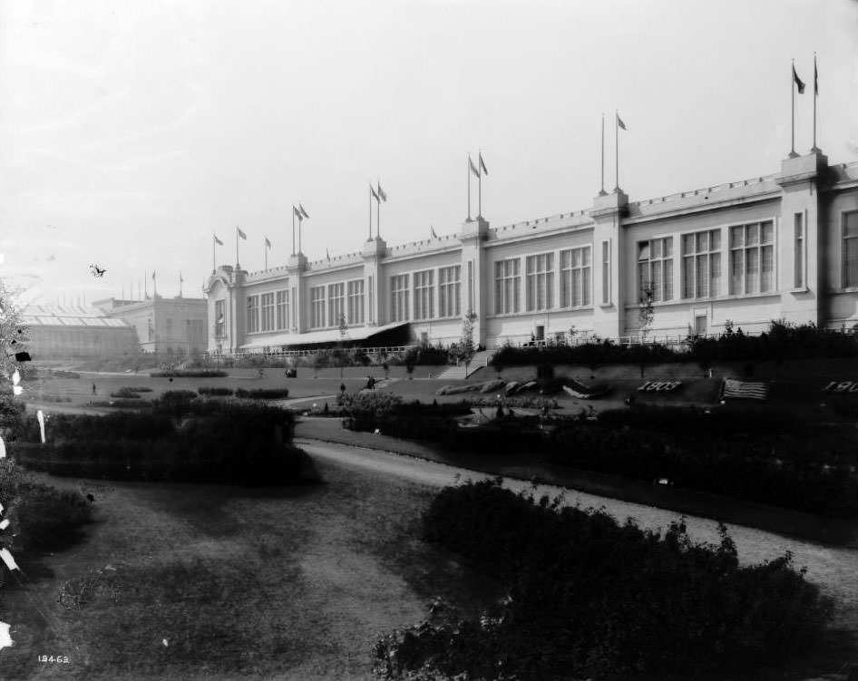 Fairgoers stroll through the gardens outside the Agriculture building at the Louisiana Purchase Exposition, 1904