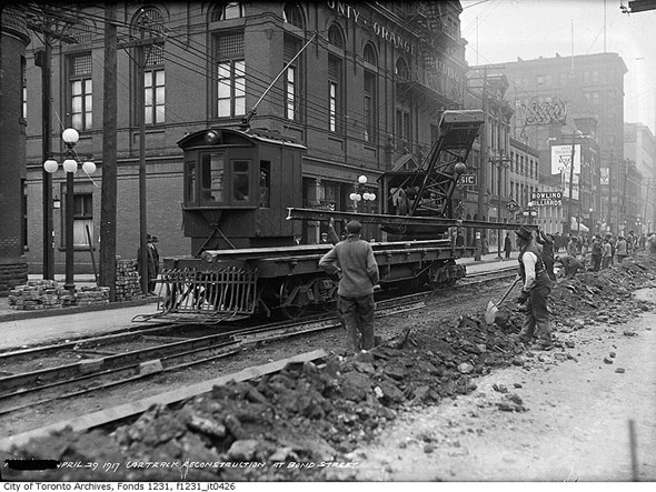 Streetcar track work at Queen and Bond streets, 1910s