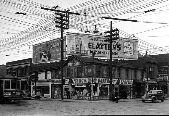 Store selling bankrupt stock at Dundas and Bay carrying an ad for Clayton's department store, 1940s