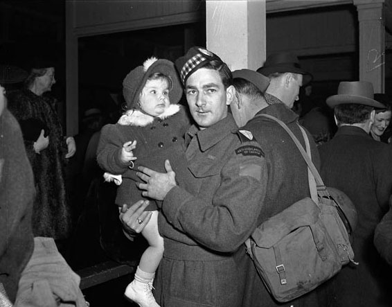 Soldier with a baby at Union Station, 1940s