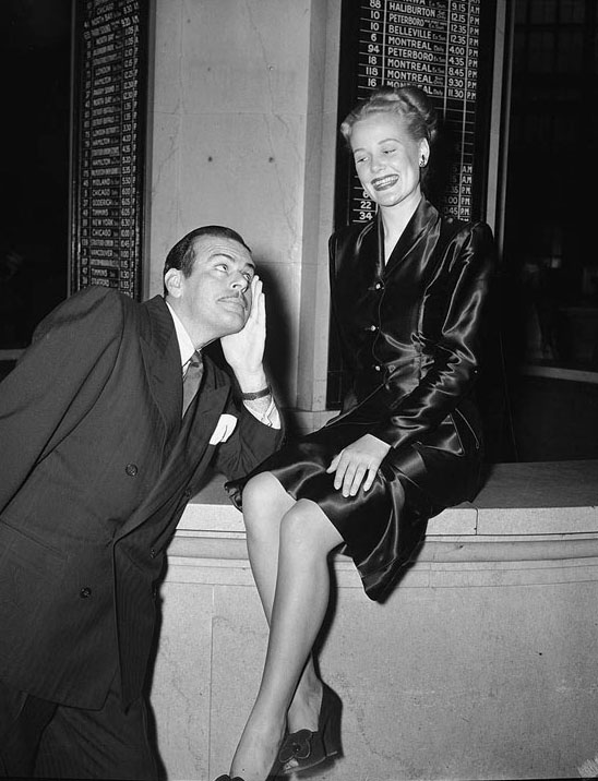 Miss Toronto 1947 poses for photos at Union Station, 1940s