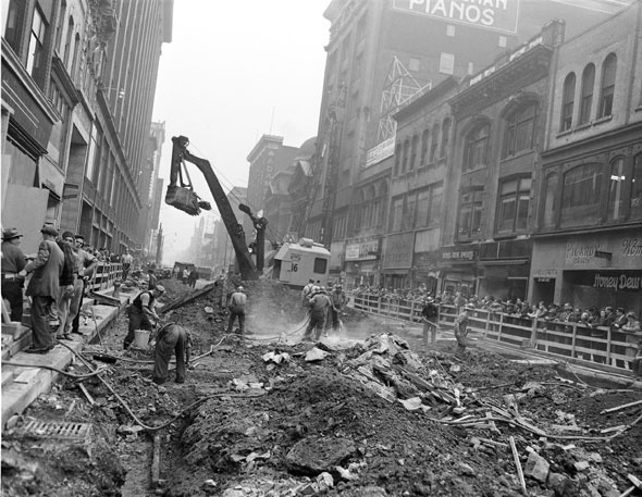 Subway construction workers begin digging down on Yonge St.