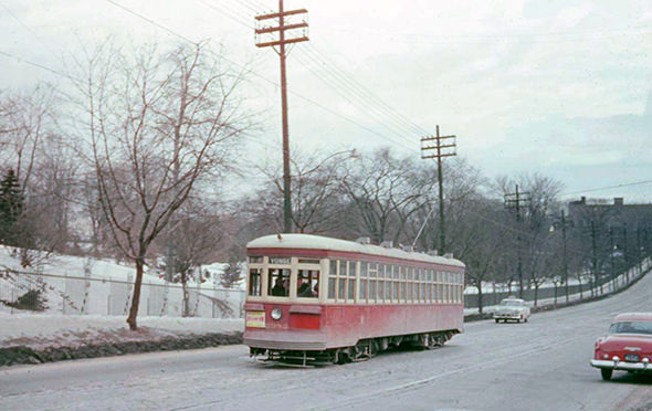 A streetcar passes Mt. Pleasant Cemetery on Yonge St. pre-subway, 1950s