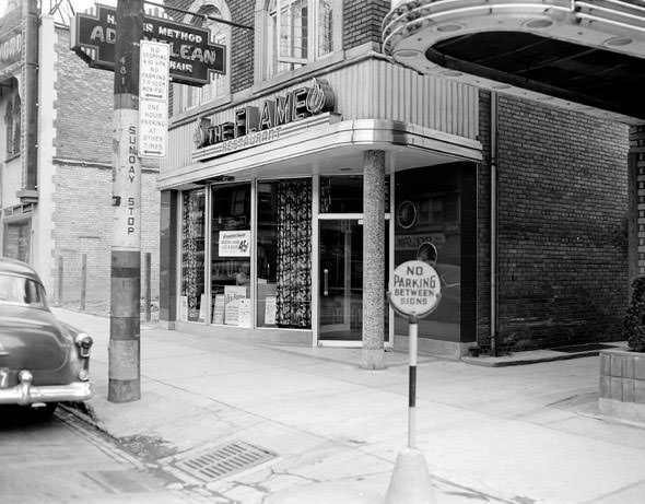 The Flame restaurant and old car, 1950s