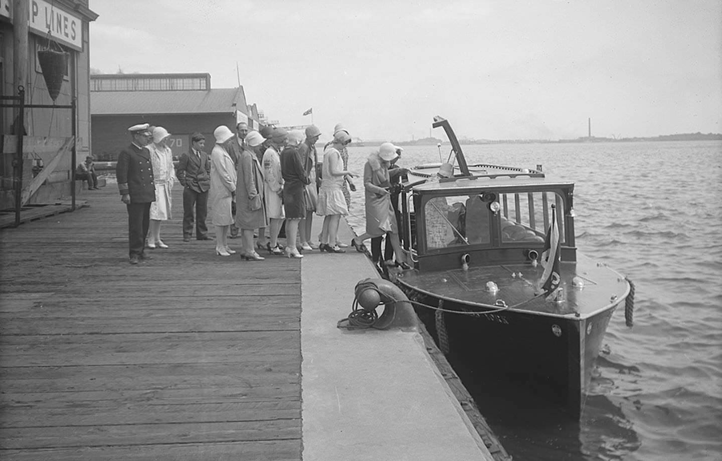 An excited group boards the Miss York motor launch for a tour through the lagoons of Toronto Island, July 29, 1929.