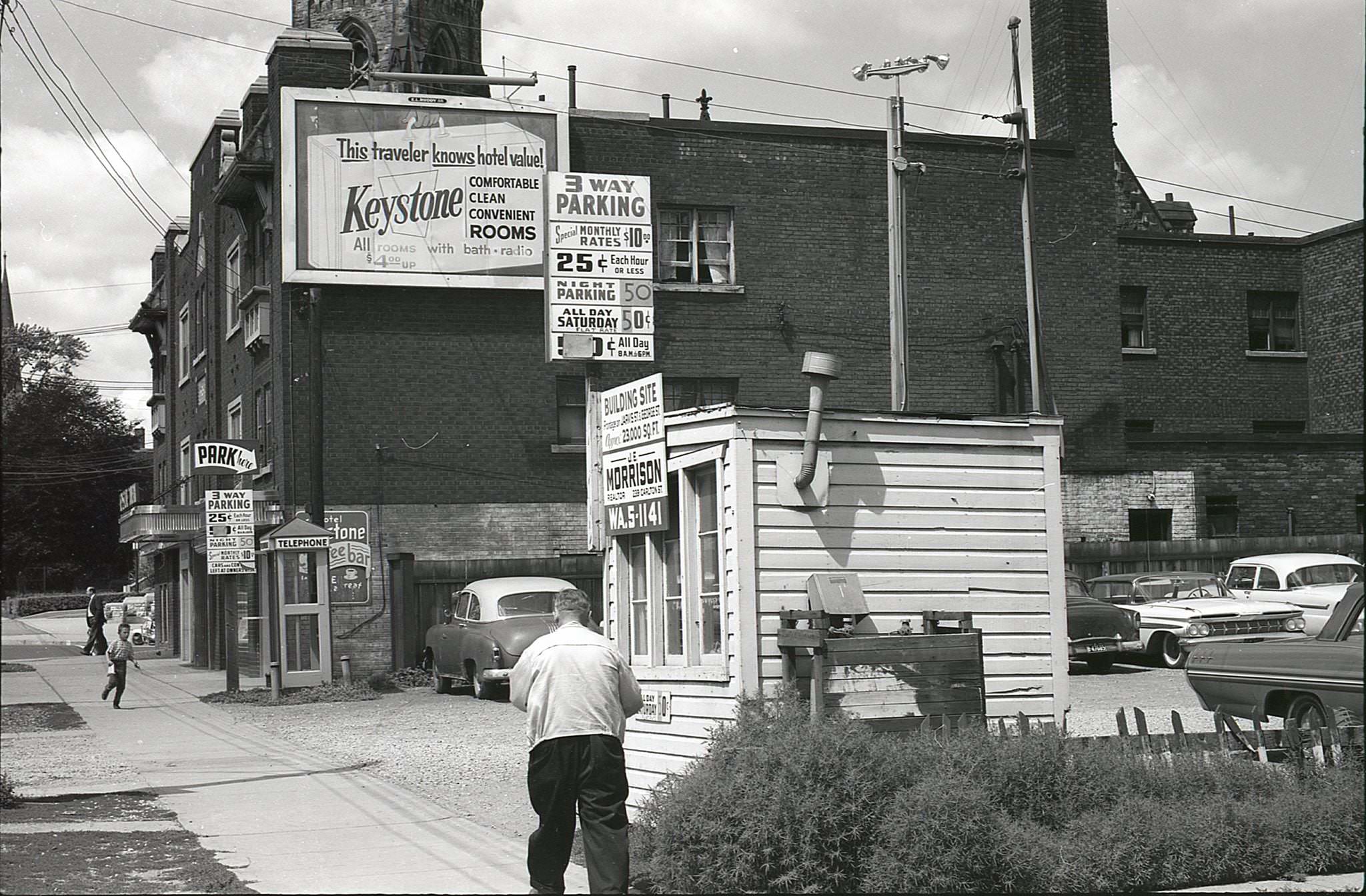 Looking north toward 335 Jarvis, then the Keystone Hotel. Jarvis Street Baptist Church tower peeking out behind, 1970s