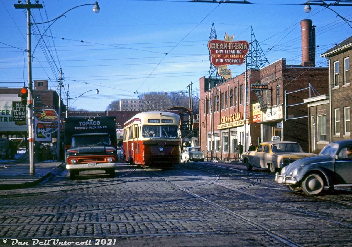 TTC PCC 4167 operates on the Bathurst route, southbound on Bathurst Street approaching Dupont alongside a Toronto Packing Company truck in March of 1963.