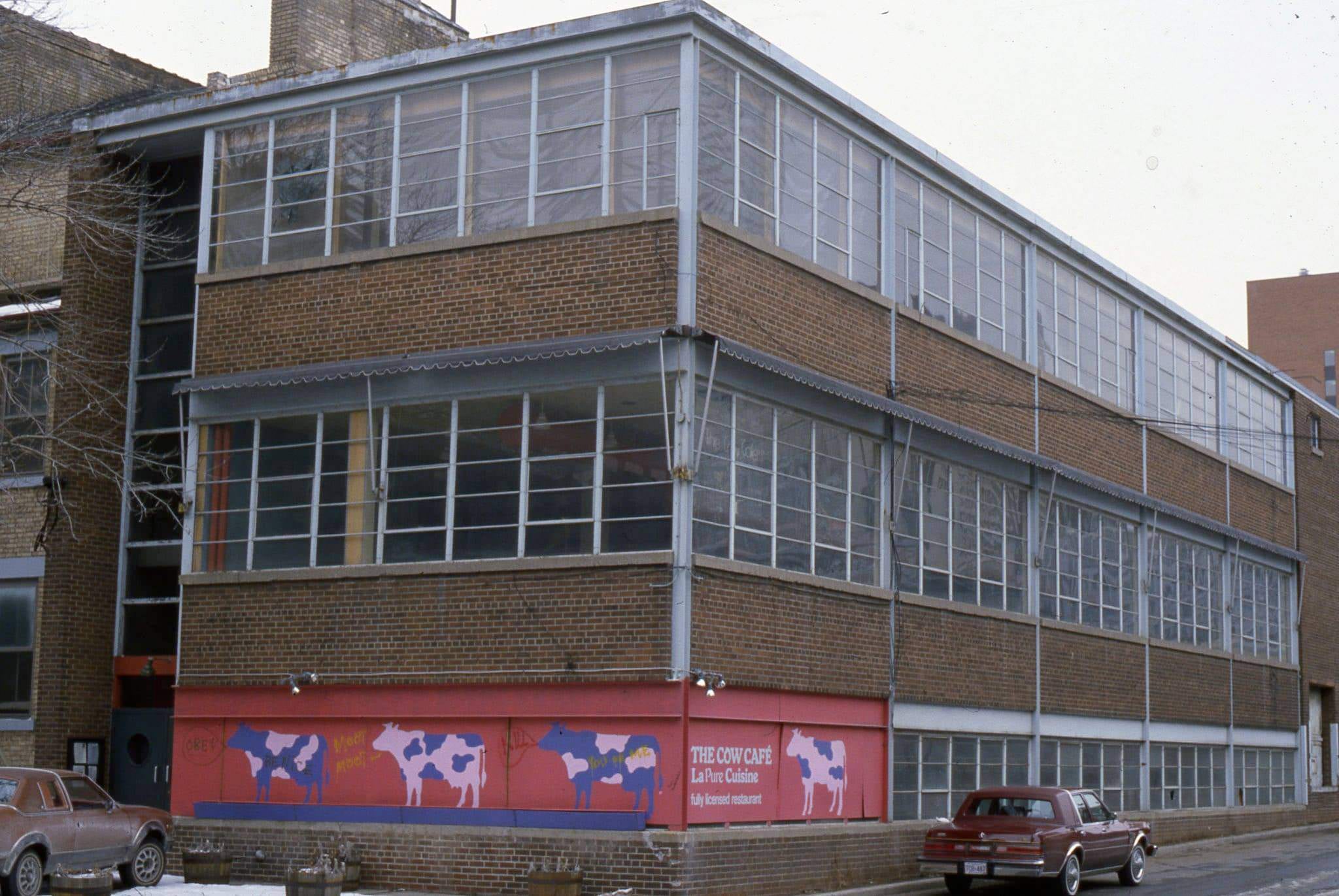 Not familiar with the building, but 'The Cow Cafe' was a vegetarian cafe, located at 165 John St., 1982