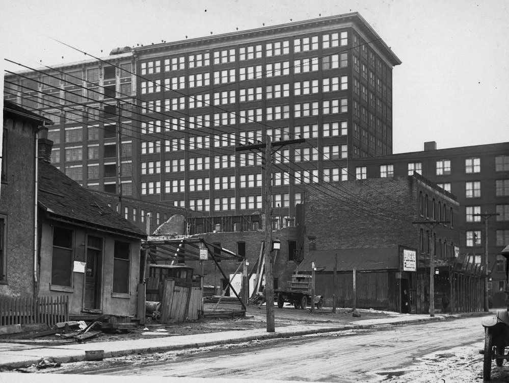 View looking east on Louisa St. to James St., the T. Eaton factory looming in the distance, 1920
