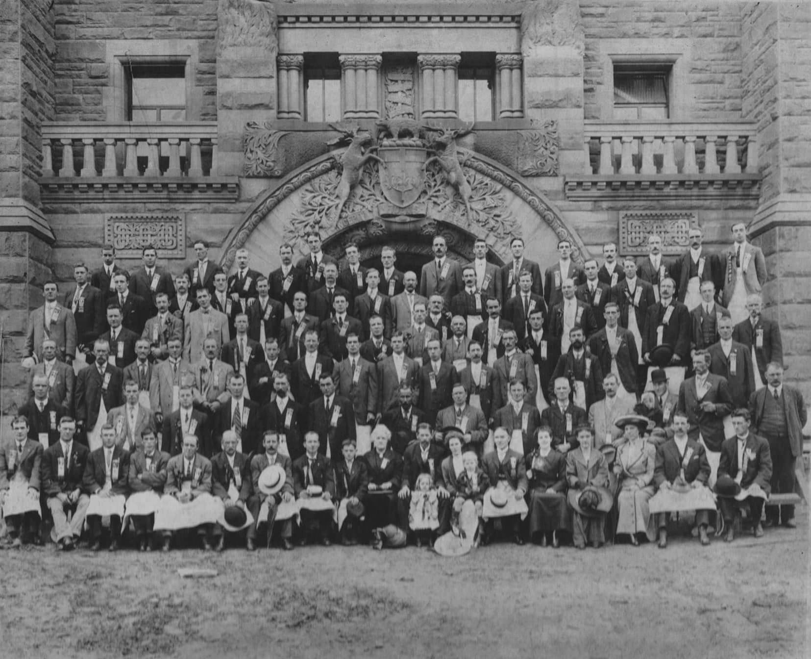 Stonecutters commemorative photo of those involved in creating the intricate carvings on the north wing of the Ontario Legislative Building in Queens Park, Toronto, 1913