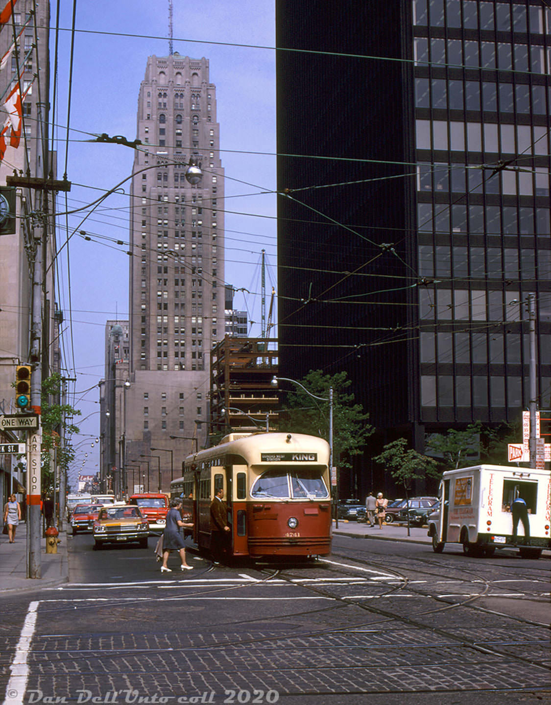 TTC PCC streetcar 4741 (acquired secondhand by Toronto, originally build for Birmingham Alabama) stops at the corner of King & York to pickup westbound passengers in June 1970.