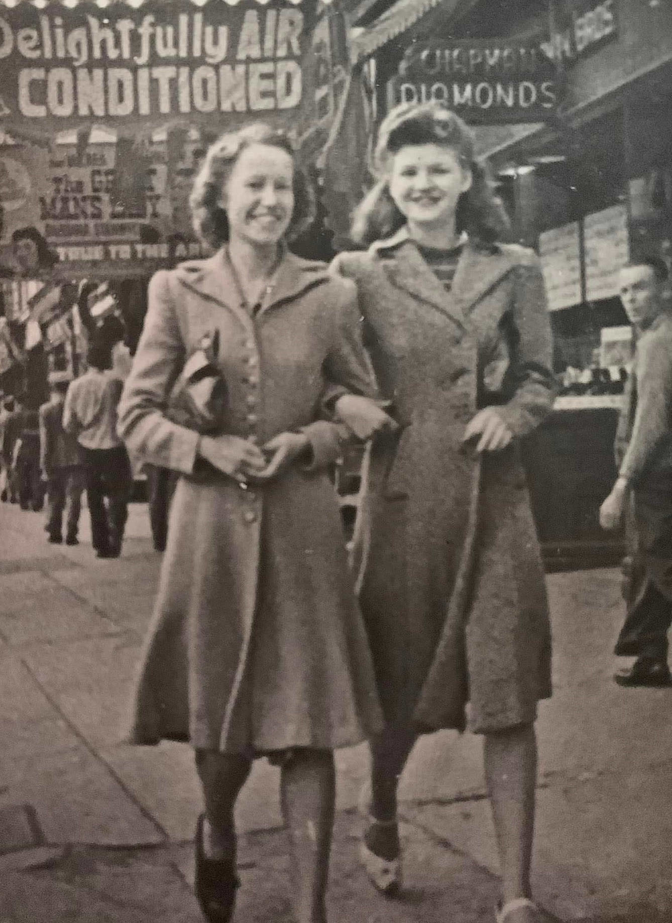 Two women walking on the street downtown Toronto early 1940s