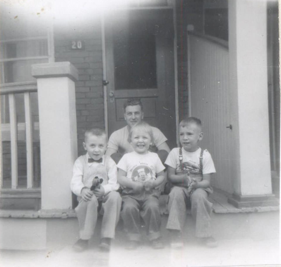 Front - Tim McNeill, Janet (Wolkowski) Soucie, Brian Wolkowski. Back - Uncle Victor Wolkowski. We are on the veranda of 20 Royal St., 1957