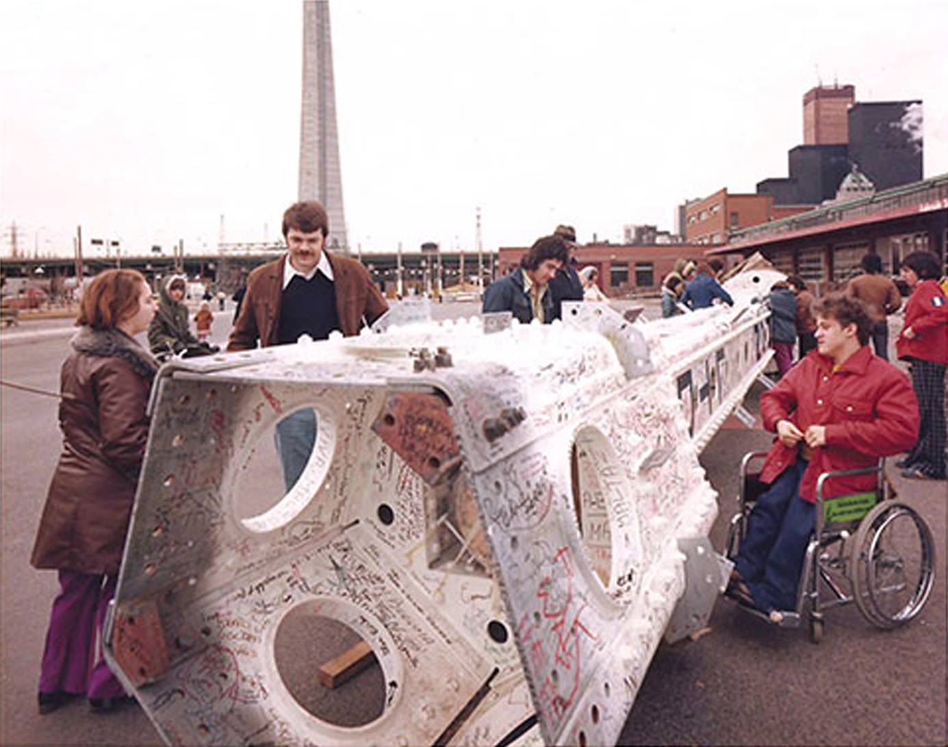 March 1975 signing of the CN Tower's top antenna segment at Harbour front but this time from the ground.