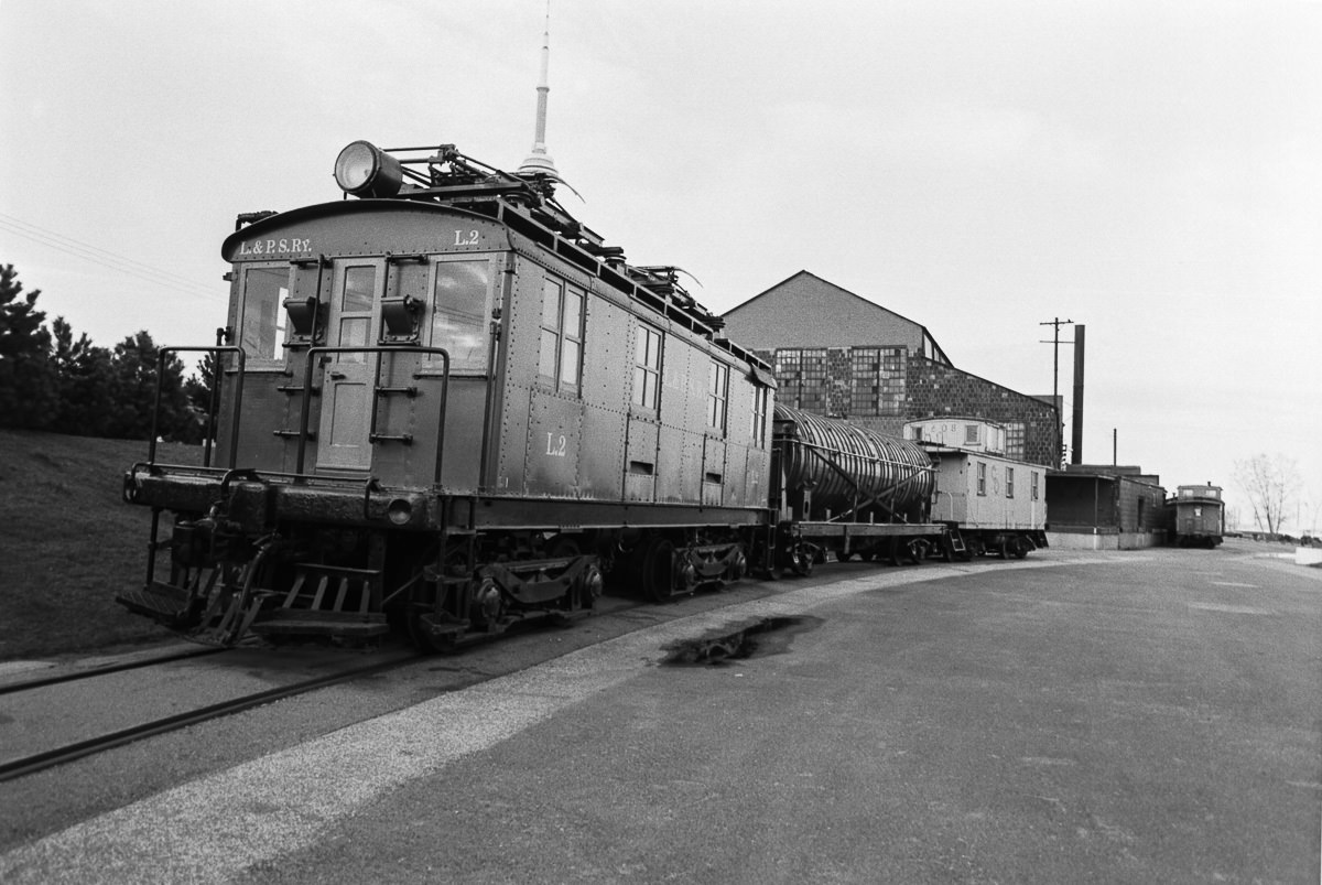 A lineup of railway artifacts. From the railway museum at Harbourfront, 1980.