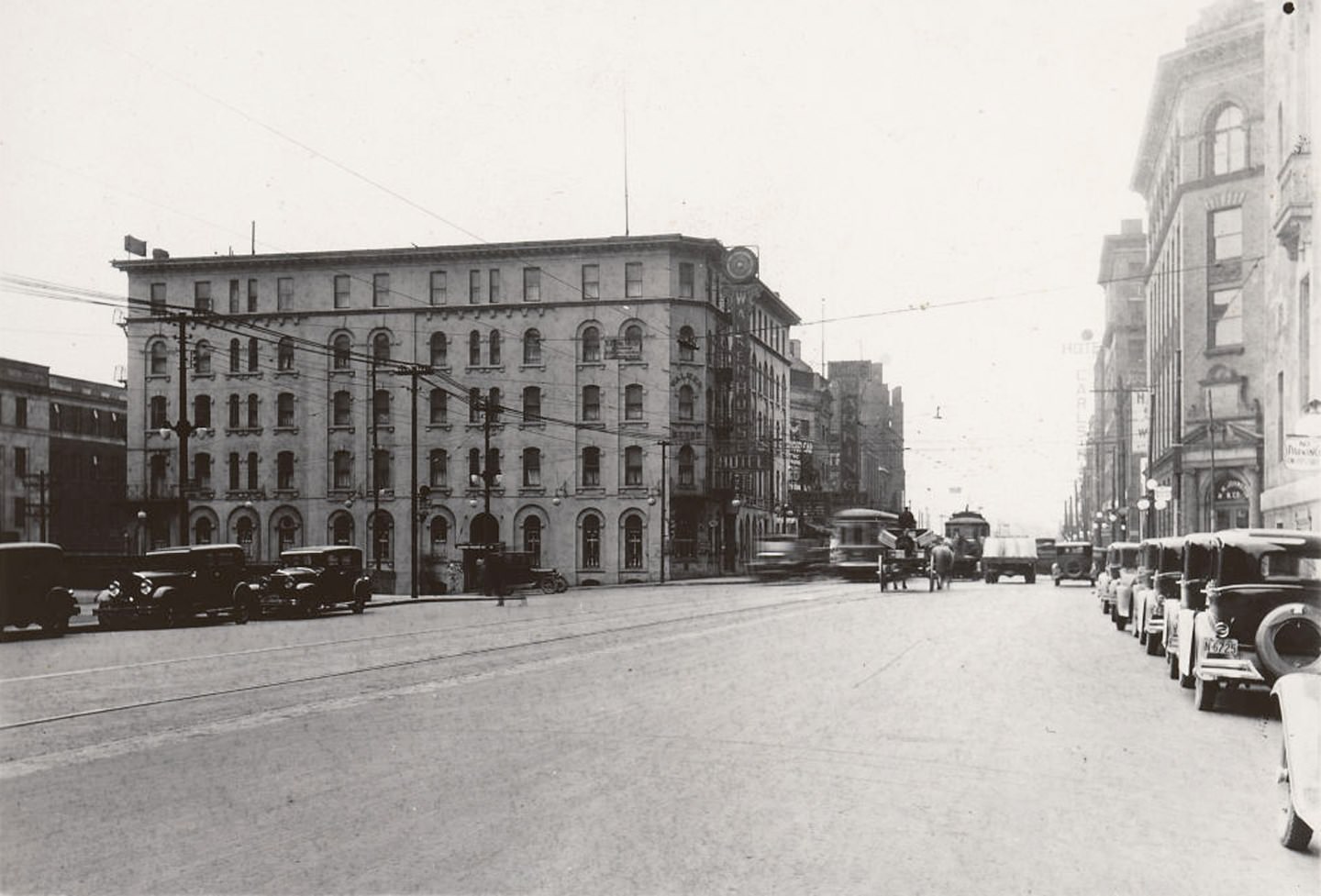 View looking west on Front St. W., towards York St., 1929. The Walker House Hotel stands prominently to left of photo.