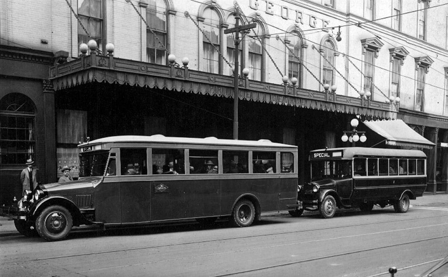 Gray Line sightseeing coach & bus no. 26 at the Prince George Hotel, corner of King & York Streets. Hotel originally opened in 1857 as the Rossin House Hotel, was renamed in 1909