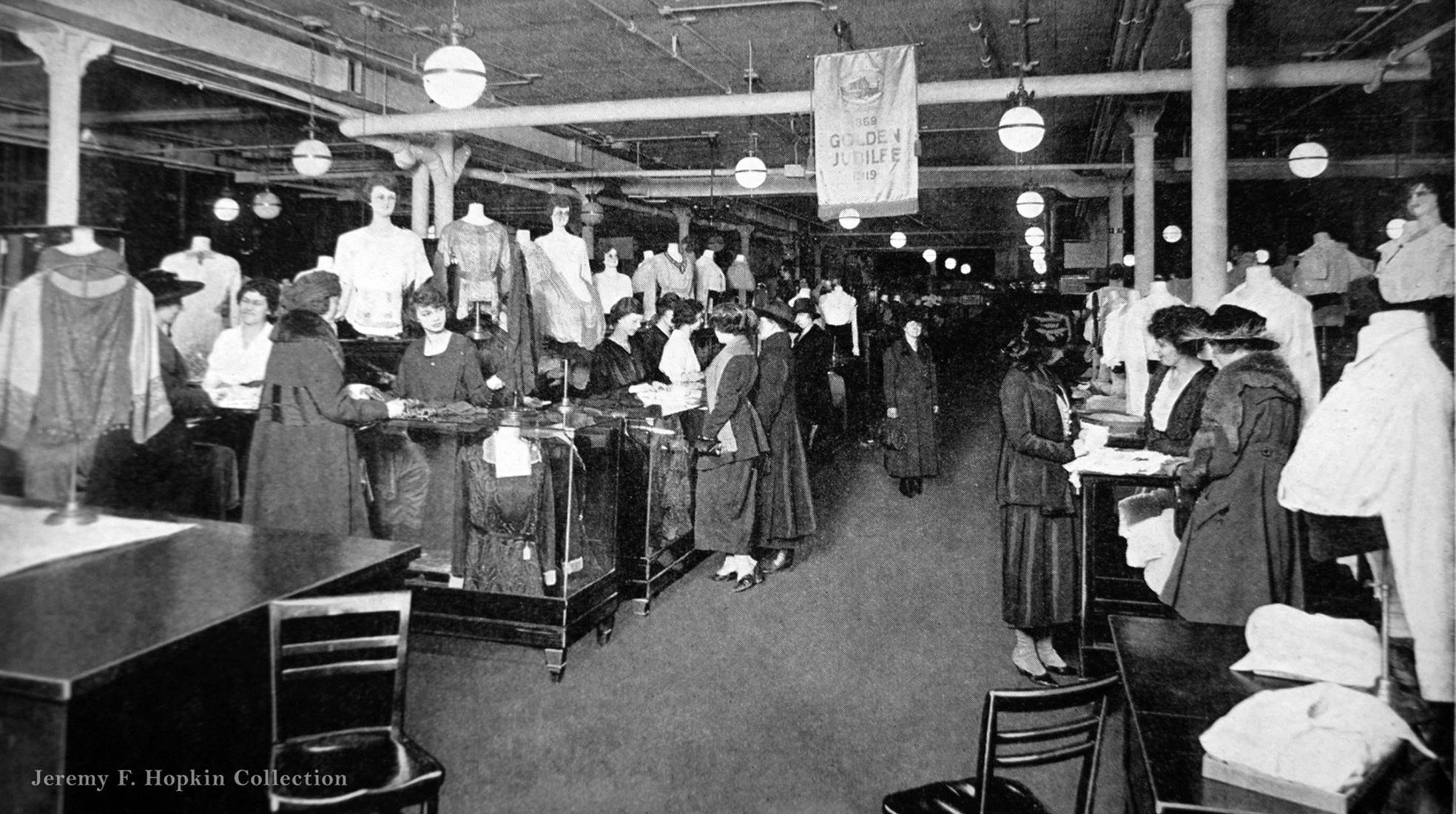 Looking down one of the aisles in the blouse department, Eaton's department store, 1950s