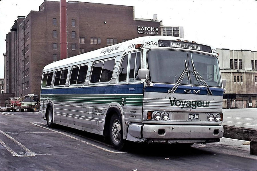 Voyageur Colonial 1834 is a former Colonial Coach Lines 1962 General Motors PD 4106 model bus with the Eaton's College Street Store in the background 1970.
