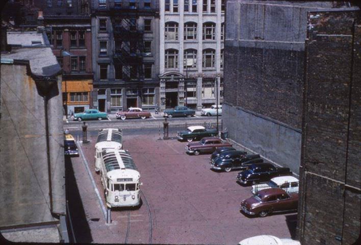 Early 50s TTC Gray coach Sightseeing busses in laneway behind 35 yonge st, ttcs old head officetill 1958
