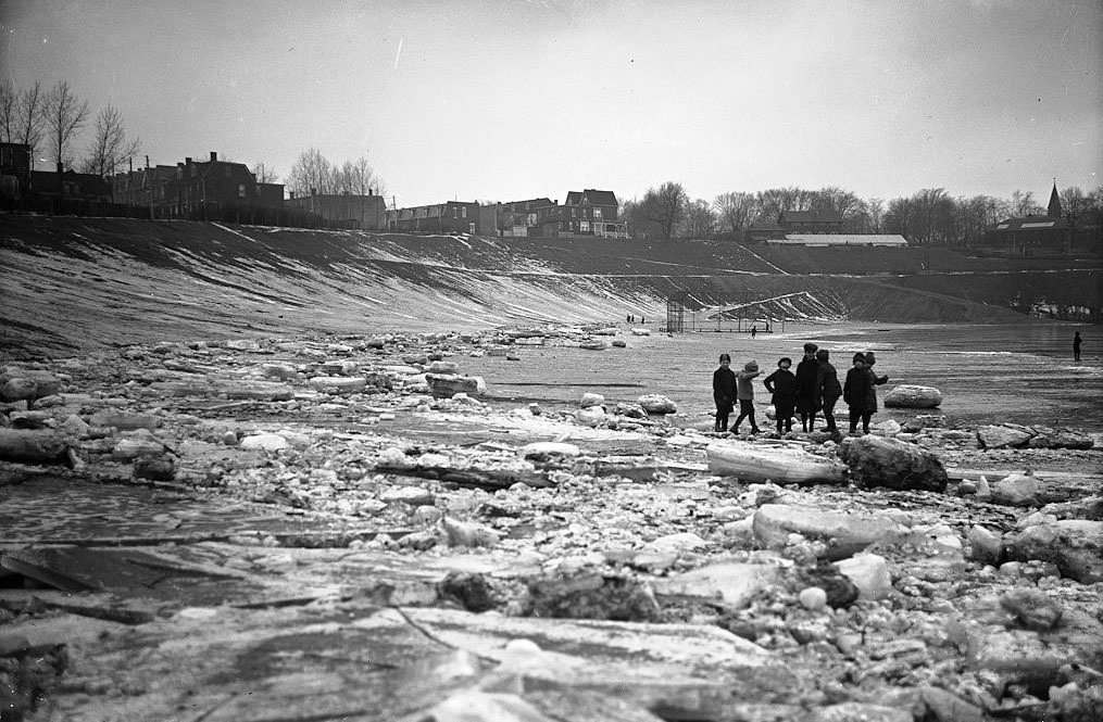 Kids playing on the ice. Riverdale West side north of Gerrard Street - February 24, 1925