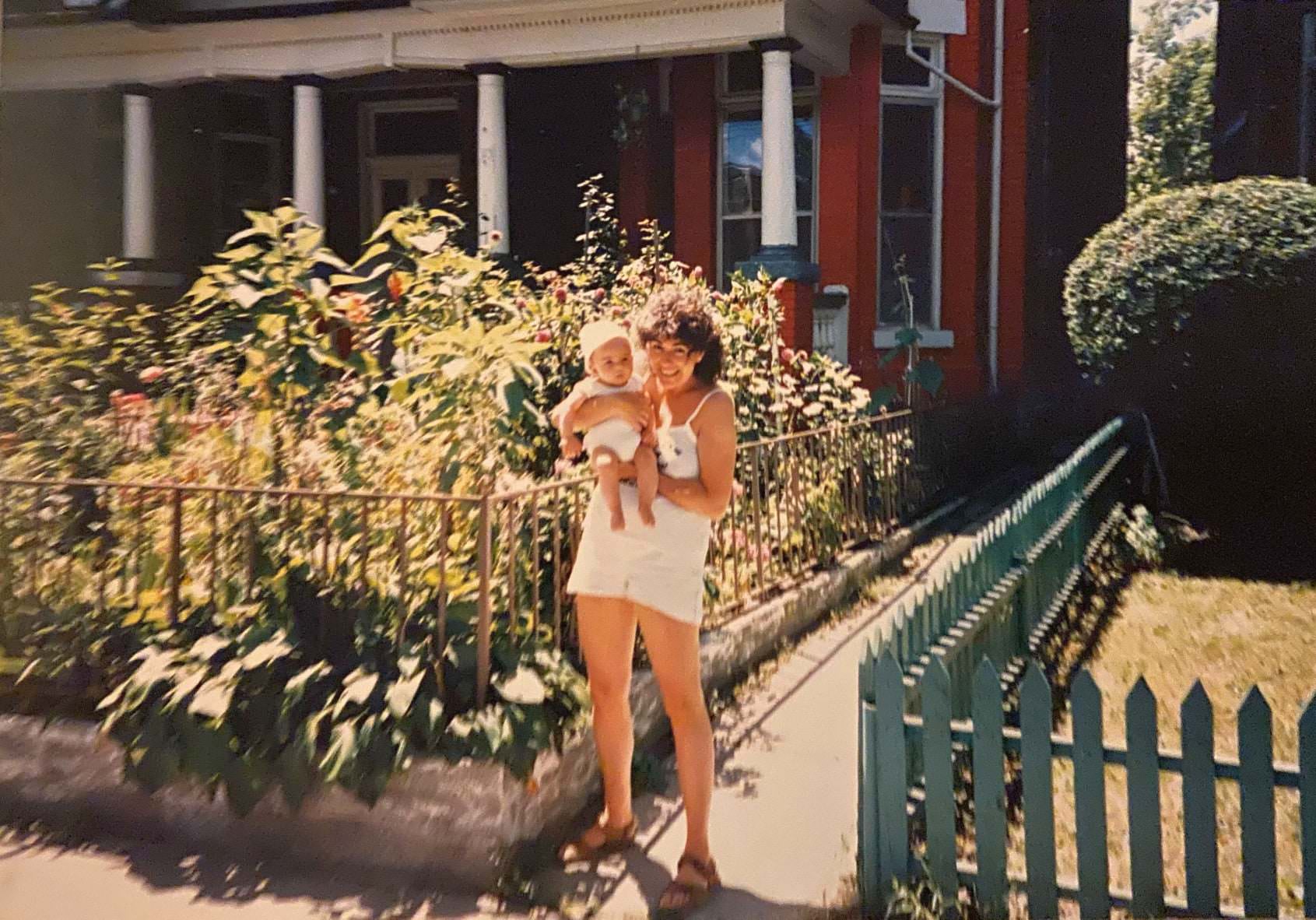 A woman holding her baby on Brunswick Avenue, 1985