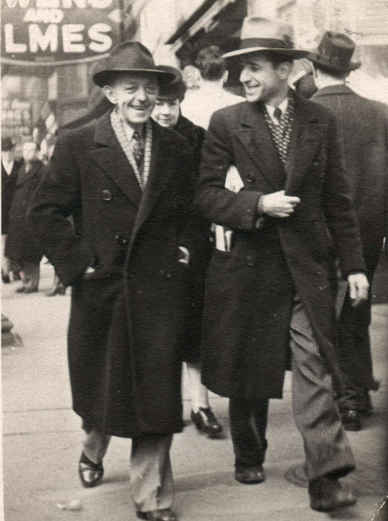 Hap Miller - Birks Engraver and Ernie Catling - MC Charters Engraver walking on Yonge below Richmond near Owens and Elmes shoe store, 1942