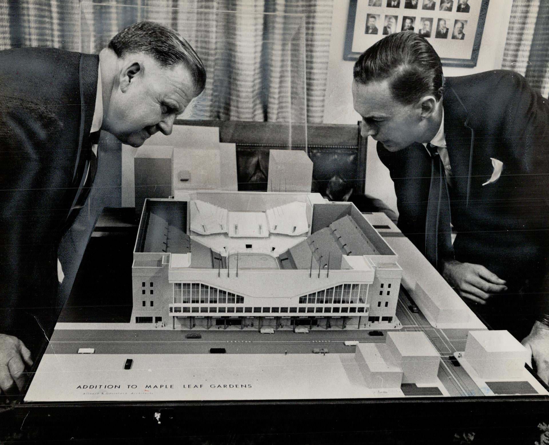 Maple leaf gardens' extension over street line on Wood and Carlton Sts.; to add 4;000 seats; was approved by city works committee yesterday. Looking at model are Gardens' vice-president H. Ballard; architect P. Allward, 1963