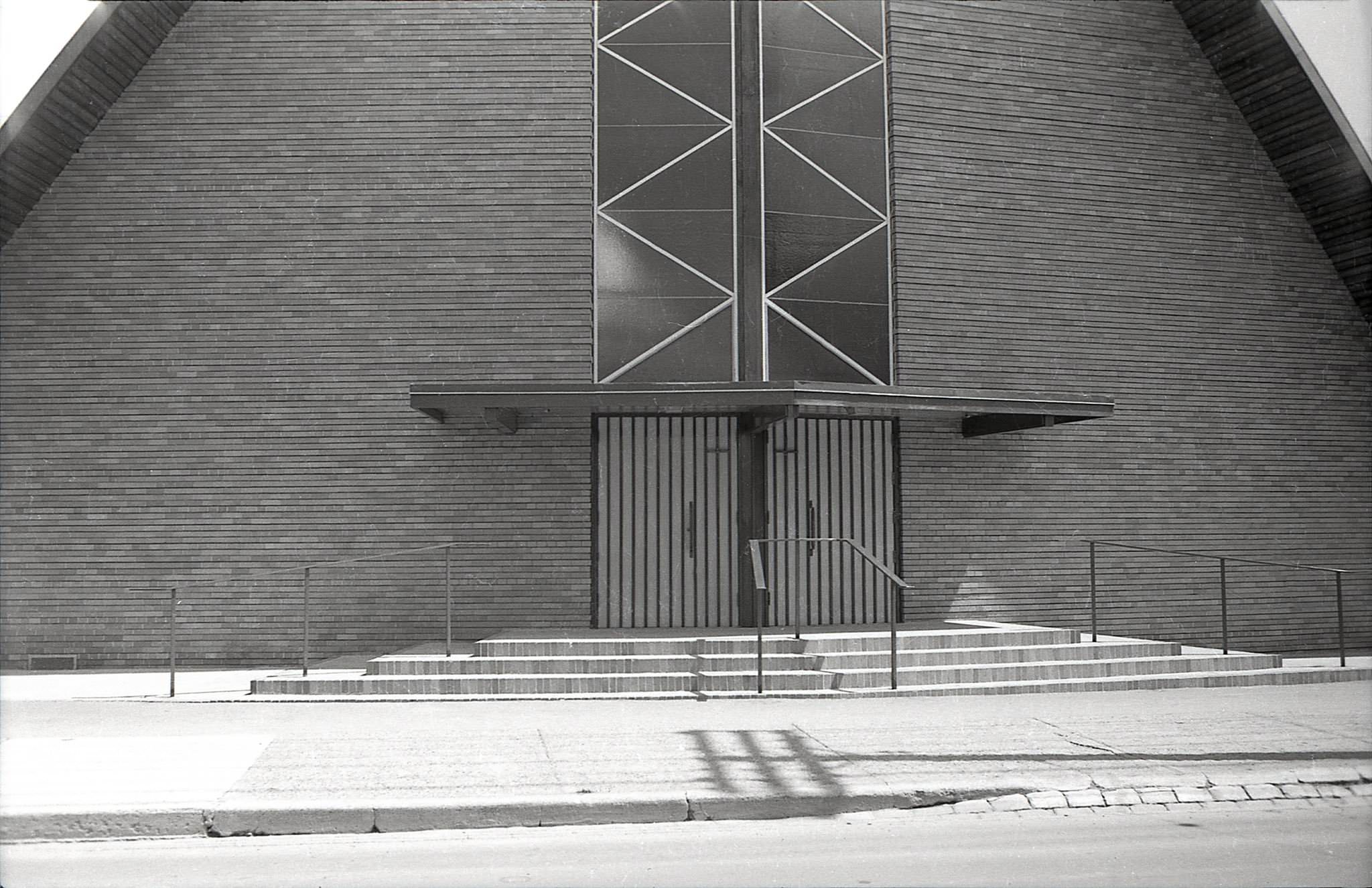 The windows have changed somewhat, but I’m fairly certain that this is Saint Peter’s Estonian Evangelical Lutheran Church, 1960s (completed 1955). East side of Mount Pleasant Ave., north of Eglinton Ave. E.