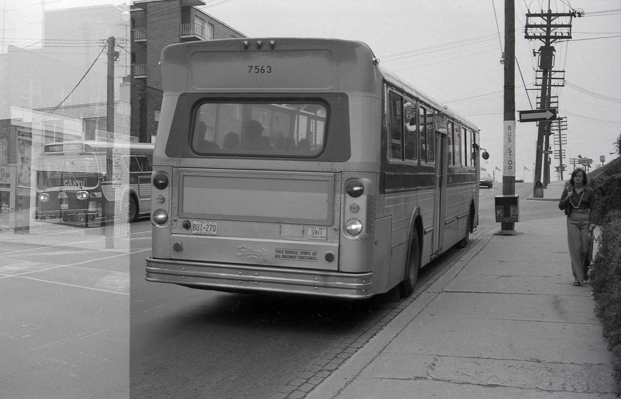 TTC Bus 7563 heading east on Eglinton West, at Kane Avenue TTC bus 7721 can be seen in the background in the second image, heading west on Eglinton Av W., 1974