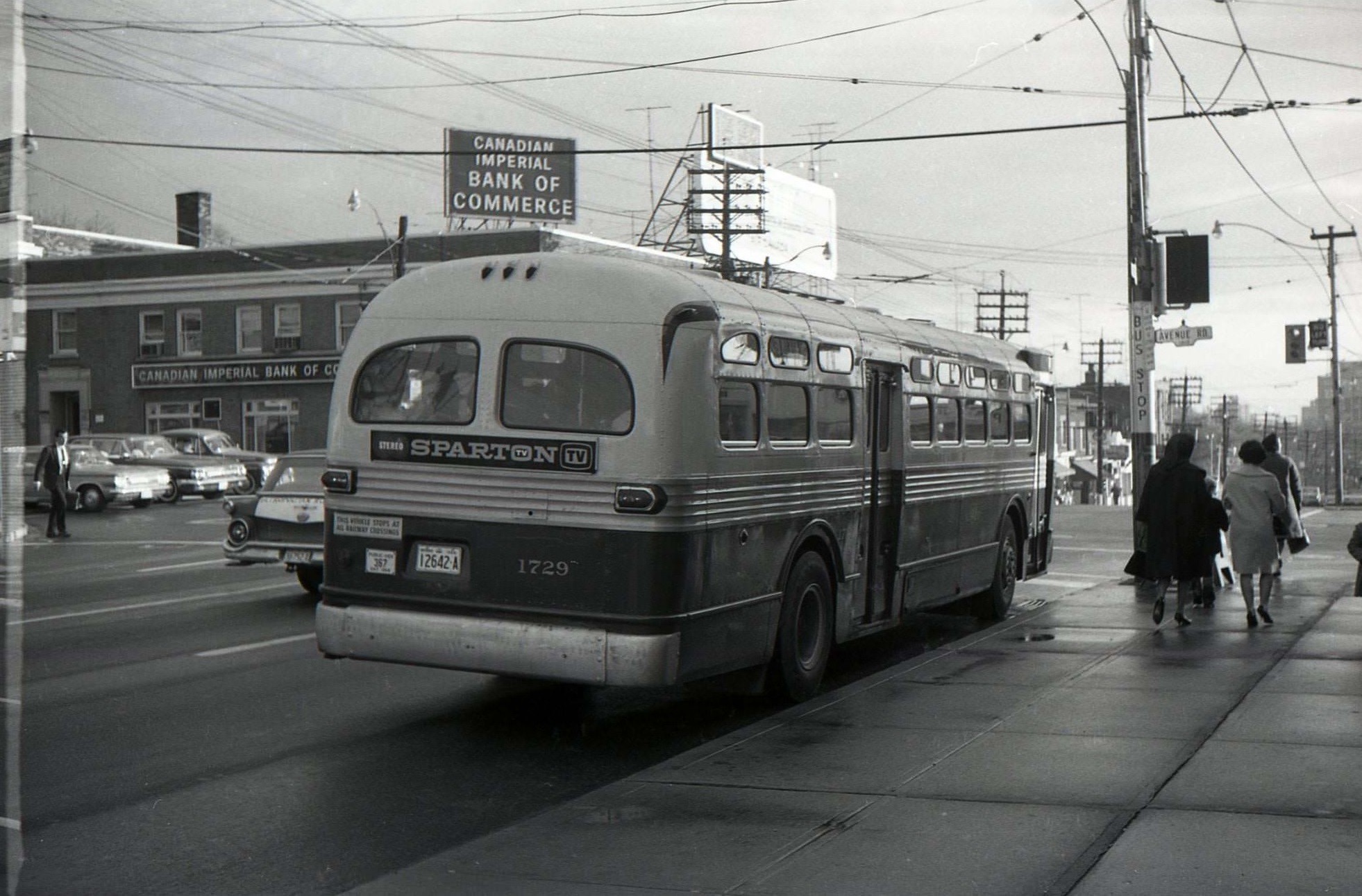 TTC bus 1729 heading east along Eglinton Avenue West in 1964 at Avenue Road.