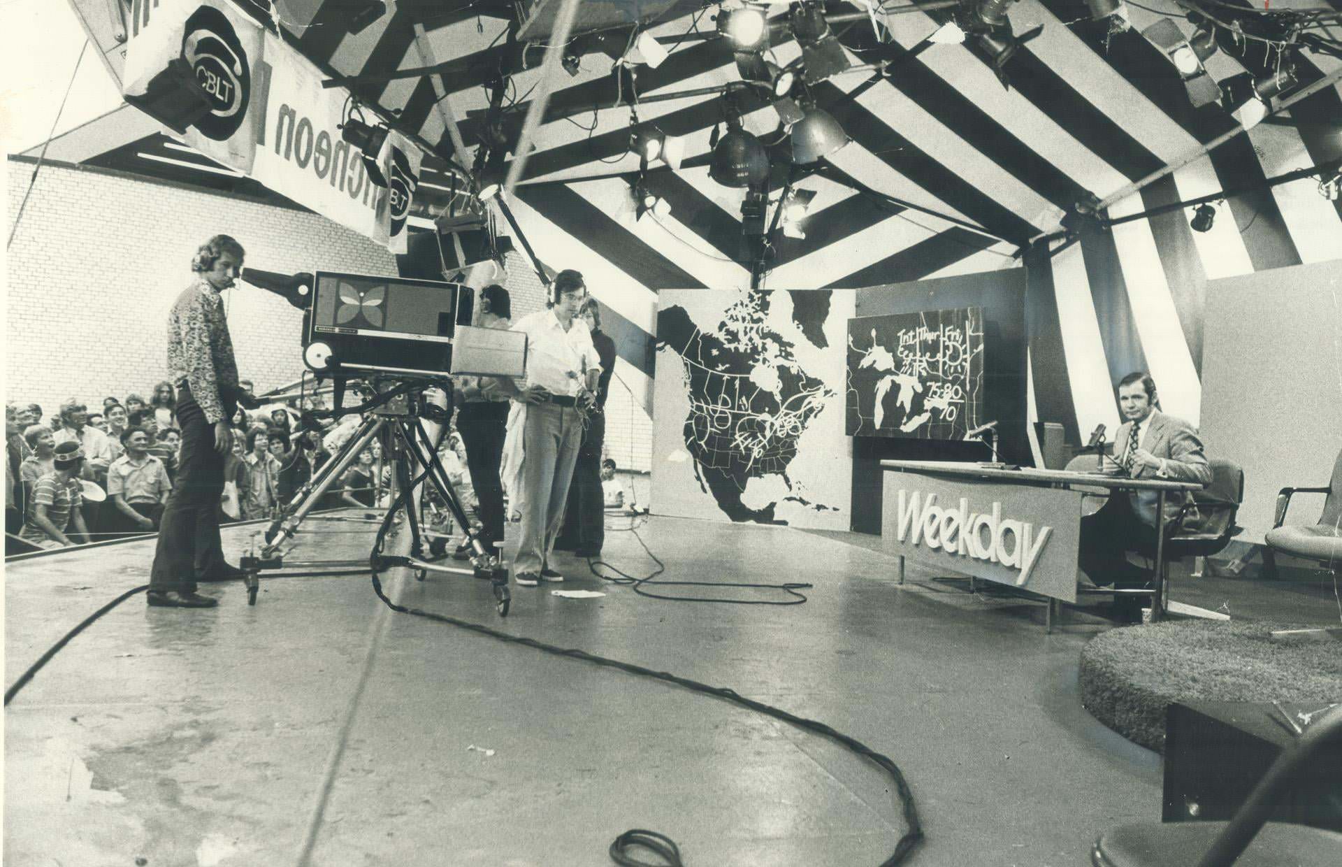Watching the action of a live TV broadcast at the CNE is fun for crowds who gather at the CBC tent near the west end of the Better Living Building, 1972