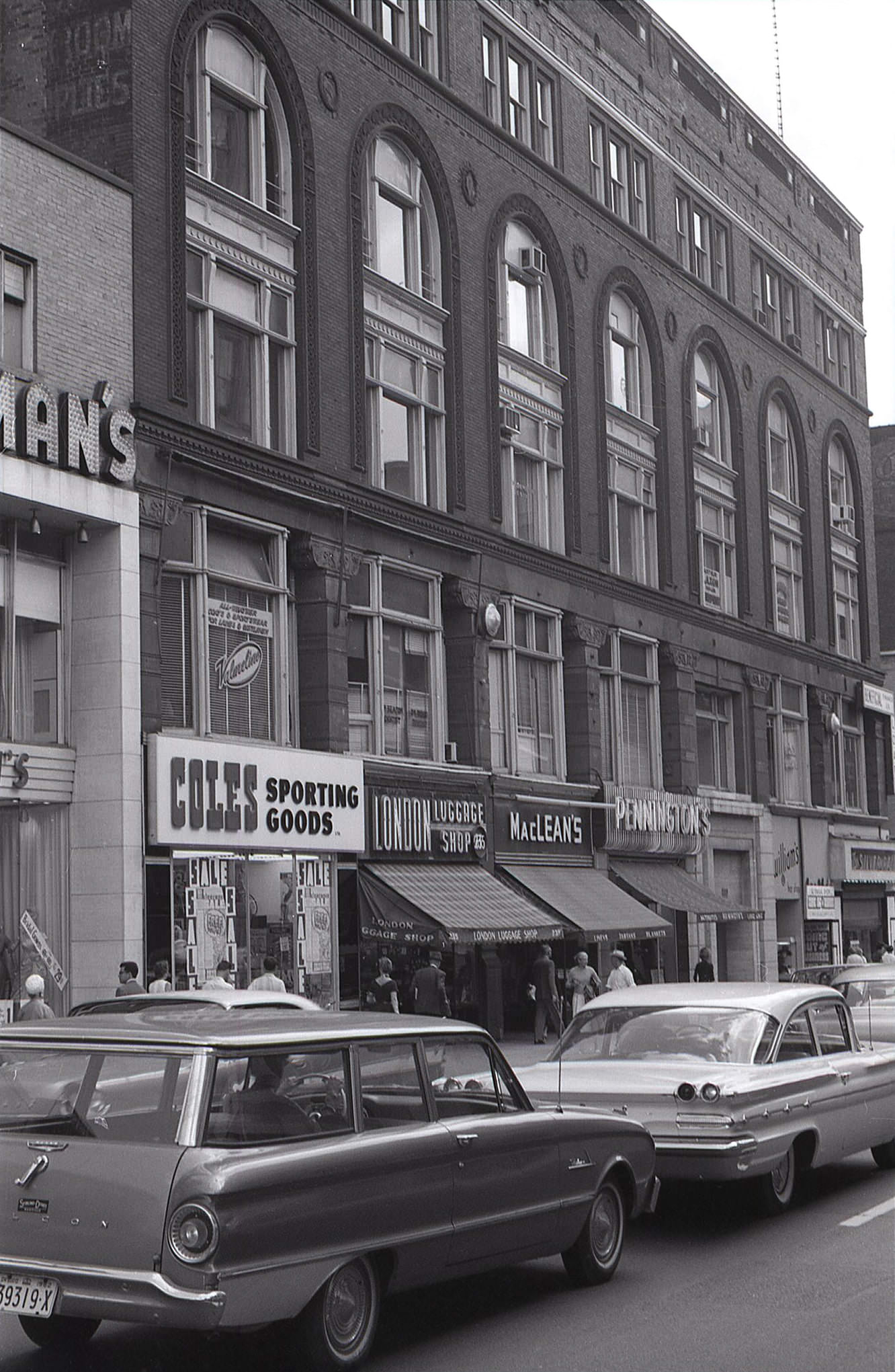 Another look at the Ryrie Building on the northeast corner of Yonge and Shuter Streets, this time from the north, providing a good view of the ground floor shops in 1962.