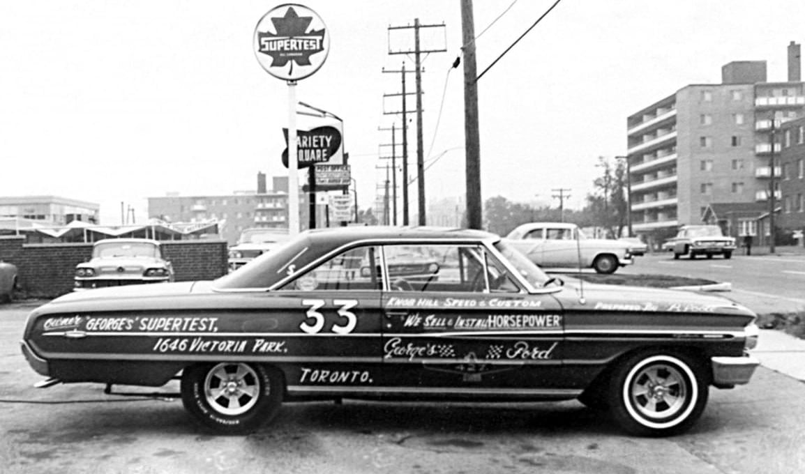 Supertest at 1646 Victoria Park looking north. Zingburger behind the car. Apartment building on the right is 1651 V.P., 1960s